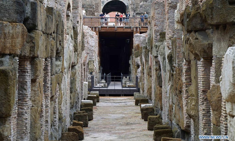 Tourists visit the hypogeum area of the Colosseo in Rome, Italy, on Aug. 24, 2021. The hypogeum area of the Colosseo, containing underground tunnels and rooms where gladiators and wild animals once prepared for battle, was accessible for visitors from June this year.(Photo: Xinhua)