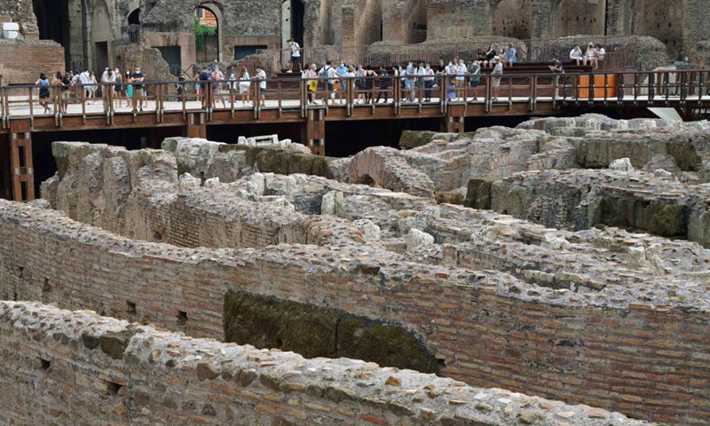 Tourists visit the hypogeum area of the Colosseo in Rome, Italy, on Aug. 24, 2021. The hypogeum area of the Colosseo, containing underground tunnels and rooms where gladiators and wild animals once prepared for battle, was accessible for visitors from June this year.(Photo: Xinhua)