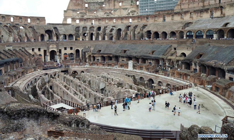 Tourists visit the hypogeum area of the Colosseo in Rome, Italy, on Aug. 24, 2021. The hypogeum area of the Colosseo, containing underground tunnels and rooms where gladiators and wild animals once prepared for battle, was accessible for visitors from June this year.(Photo: Xinhua)