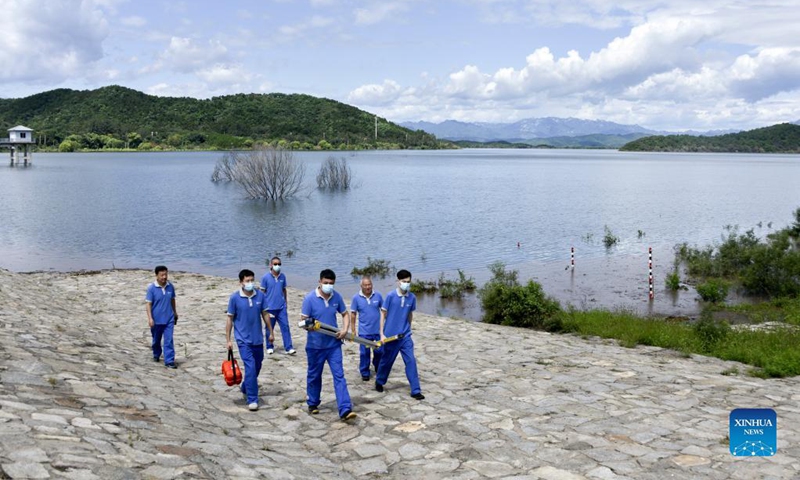 Staff members carry out dam safety inspection at the Miyun Reservoir in Beijing, capital of China, Aug. 25, 2021. Photo:Xinhua