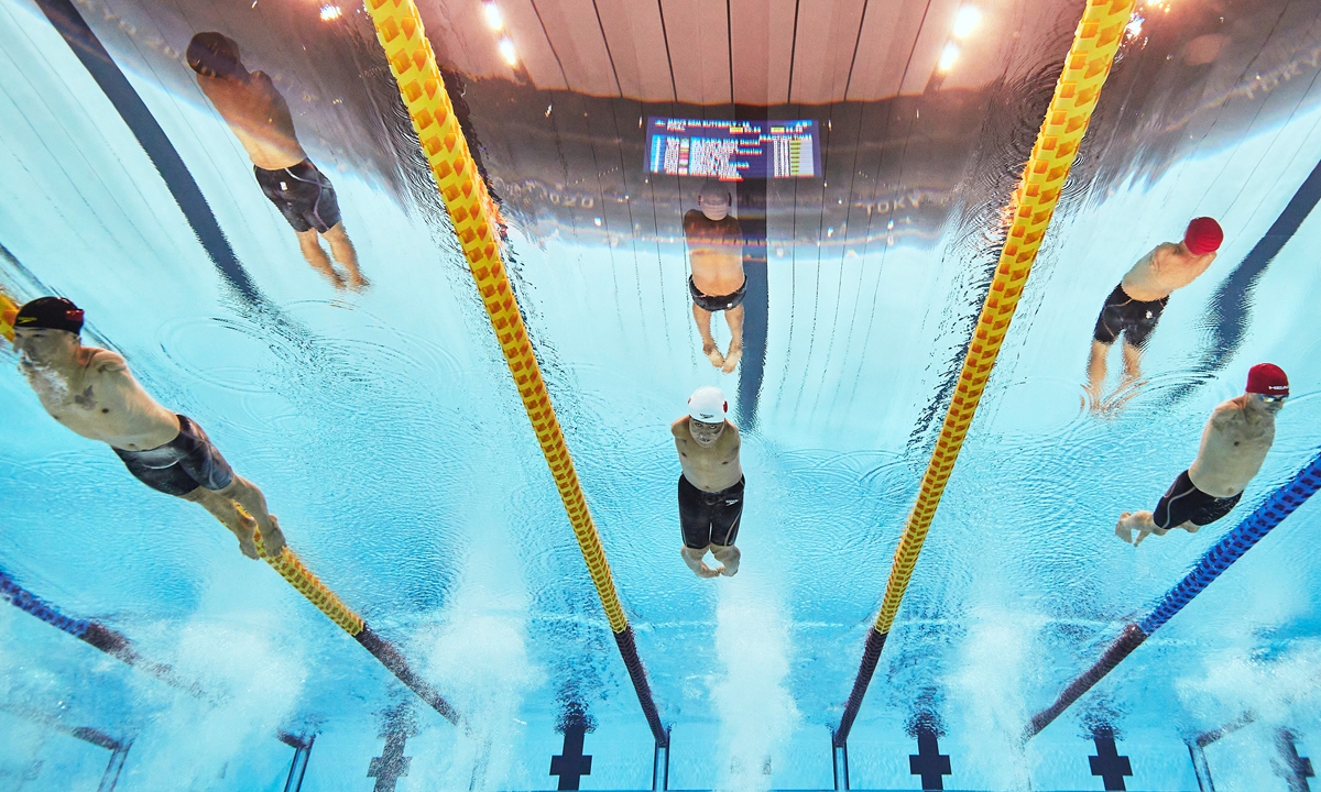 Team China's Zheng Tao and Yuan Weiyi, and Yaroslav Semenenko of Team Ukraine compete during the men's 50m butterfly - S5 final on at the Tokyo 2020 Paralympic Games on Friday. Zheng, another Chinese swimmer Wang Lichao, and Yuan got the gold, silver and bronze, respectively. Photo: VCG