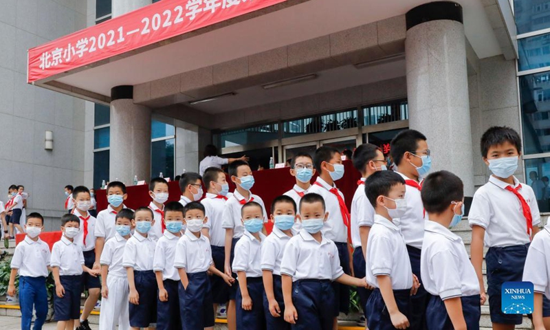 Students wait to attend the opening ceremony for the new semester at Beijing Primary School Guangwai branch in Beijing, capital of China, Aug. 31, 2021.Photo:Xinhua