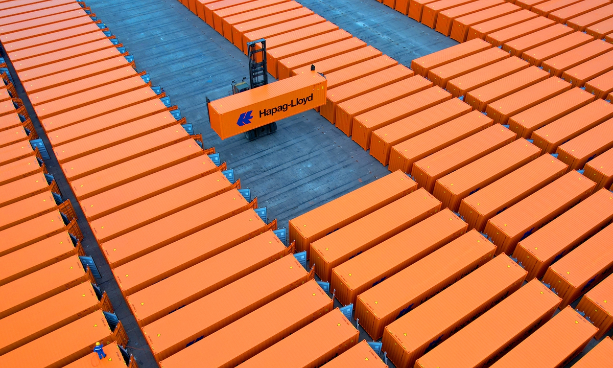 Newly manufactured containers at the inspection site of China International Marine Containers Group in Taicang, East China's Jiangsu Province are ready to be shipped overseas on Thursday. In the first eight months of the year, the company produced 152,000 containers, 90 percent of which have been exported. Photo: cnsphoto