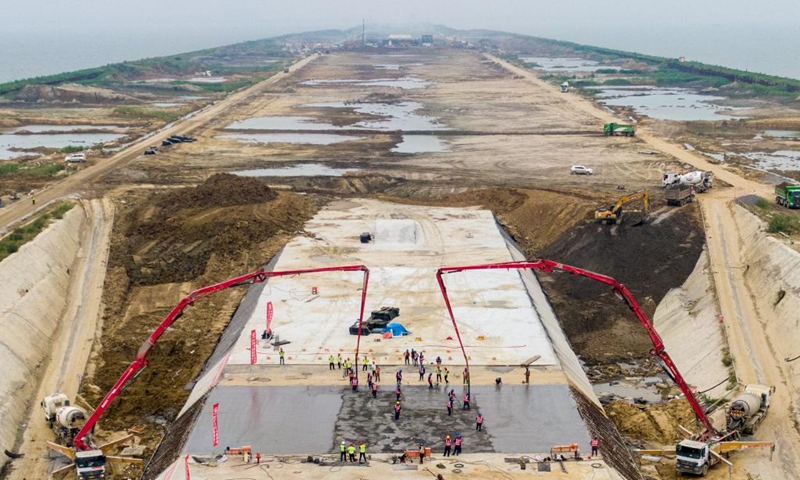 Aerial photo taken on Sept. 5, 2021 shows the construction site of Nanquan section of Taihu tunnel, part of the Changzhou-Wuxi Highway, in Wuxi, east China's Jiangsu Province. The main construction of the Nanquan section of the Taihu tunnel was completed on Sunday. Taihu tunnel, China's longest underwater highway tunnel, is part of the Changzhou-Wuxi Highway which has a total length of 43.9 km. The 10.8-km-long, 43.6-meter-wide tunnel is under Taihu Lake, China's third-largest freshwater lake. (Xinhua/Li Bo) 