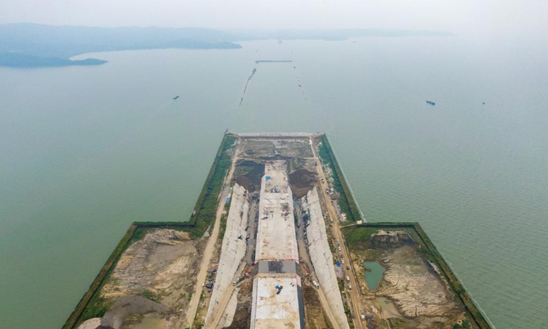 Aerial photo taken on Sept. 5, 2021 shows the construction site of Nanquan section of Taihu tunnel, part of the Changzhou-Wuxi Highway, in Wuxi, east China's Jiangsu Province. The main construction of the Nanquan section of the Taihu tunnel was completed on Sunday. Taihu tunnel, China's longest underwater highway tunnel, is part of the Changzhou-Wuxi Highway which has a total length of 43.9 km. The 10.8-km-long, 43.6-meter-wide tunnel is under Taihu Lake, China's third-largest freshwater lake. (Xinhua/Li Bo)  