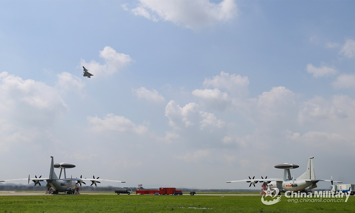 A fighter jet soars into the sky during a coordination flight training exercise conducted by the naval aviation troops under the PLA Eastern Theater Command in late August, 2021. The coordination training aimed to hone the joint combat capability of multi-type warplanes under complex conditions. (eng.chinamil.com.cn/Photo by Deng Peng)