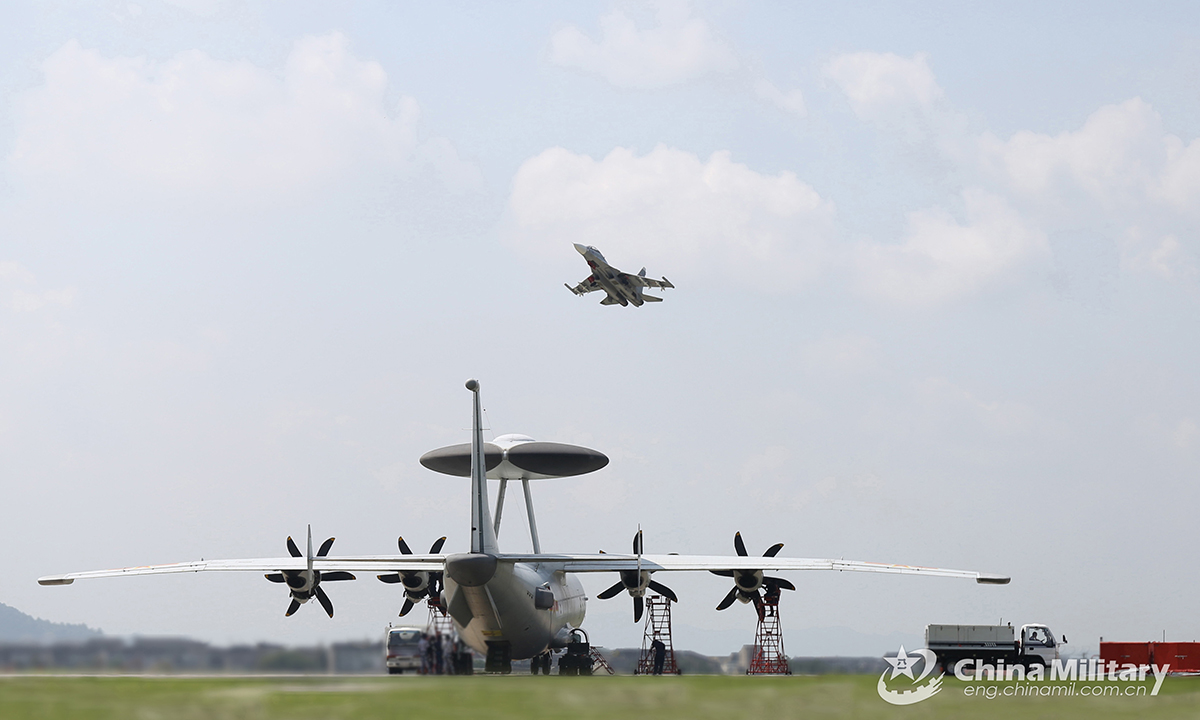 A fighter jet soars into the sky during a coordination flight training exercise conducted by the naval aviation troops under the PLA Eastern Theater Command in late August, 2021. The coordination training aimed to hone the joint combat capability of multi-type warplanes under complex conditions. (eng.chinamil.com.cn/Photo by Deng Peng)