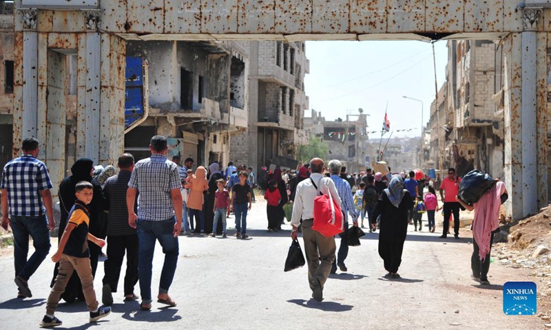 People return to their homes in Syria's southern province of Daraa, on Sept. 9, 2021. Thousands of people started returning to their homes in Daraa on Thursday following the army's entry to the formerly rebel-held areas, state news agency SANA reported.Photo:Xinhua