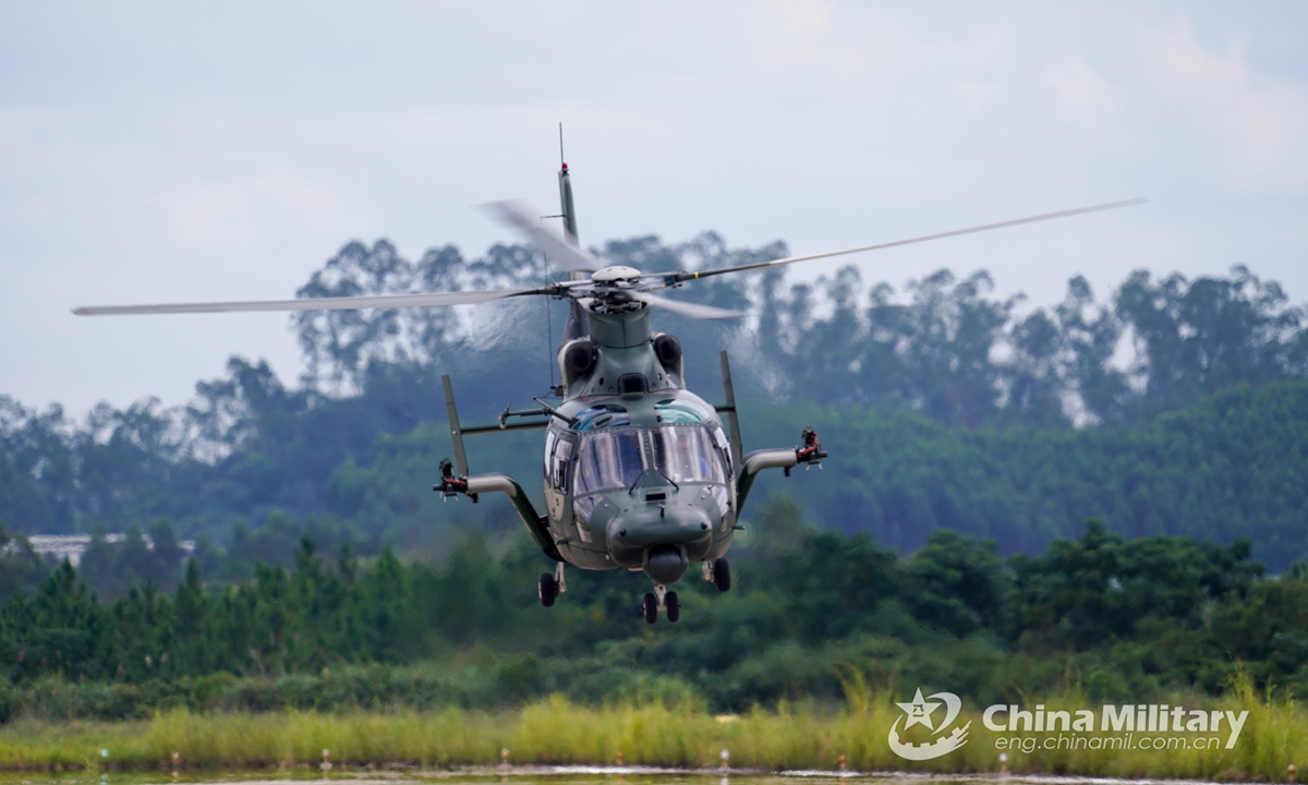 Two helicopters attached to an army aviation brigade under the PLA 74th Group Army fly in formation during a flight training exercise involving multiple types of helicopters on September 1, which aims to hone the flight skills of pilots.Photo:China Military