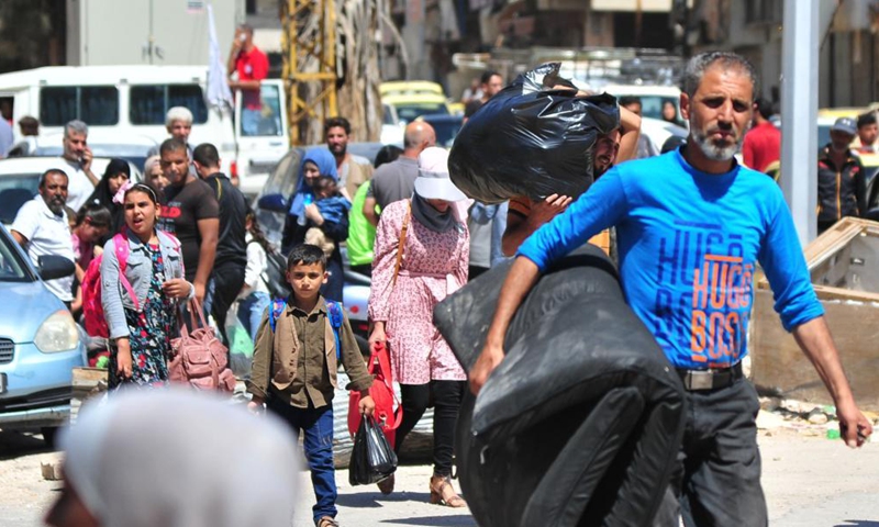 People return to their homes in Syria's southern province of Daraa, on Sept. 9, 2021. Thousands of people started returning to their homes in Daraa on Thursday following the army's entry to the formerly rebel-held areas, state news agency SANA reported.Photo:Xinhua