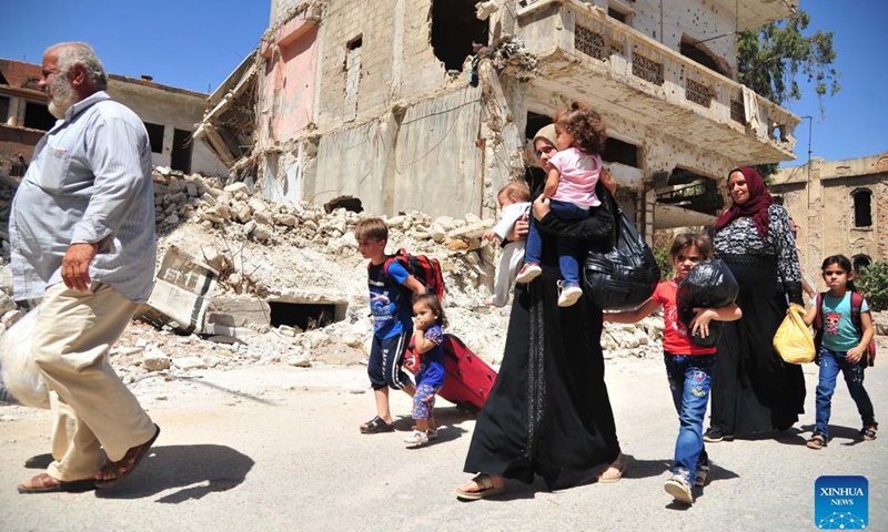 People return to their homes in Syria's southern province of Daraa, on Sept. 9, 2021. Thousands of people started returning to their homes in Daraa on Thursday following the army's entry to the formerly rebel-held areas, state news agency SANA reported.Photo:Xinhua