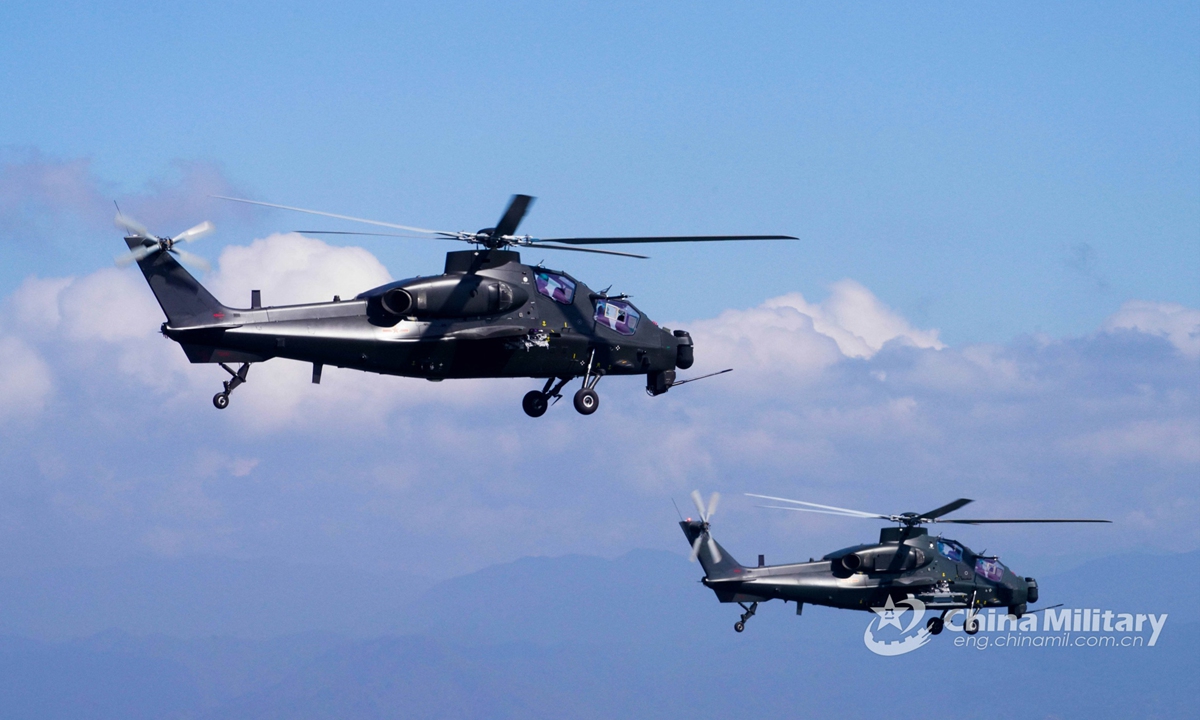 Two helicopters attached to an army aviation brigade under the PLA 74th Group Army fly in formation during a flight training exercise involving multiple types of helicopters on September 1, which aims to hone the flight skills of pilots.Photo:China Military