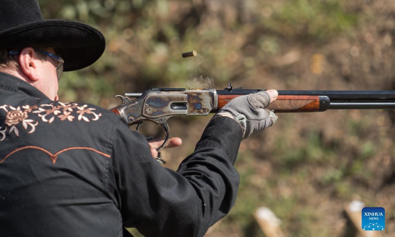 A man competes at the Cowboy Action Shooting Hungarian Championship in Jaszfelsoszentgyorgy, Hungary on Sept. 11, 2021. (Photo: Xinhua)