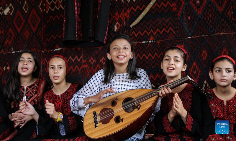 Children sing traditional songs as they participate in the first children's choir group to revive the Palestinian old heritage songs at Al Qarara Cultural Museum, east of the southern Gaza Strip city of Khan Younis, on Sept. 11, 2021.Photo: Xinhua