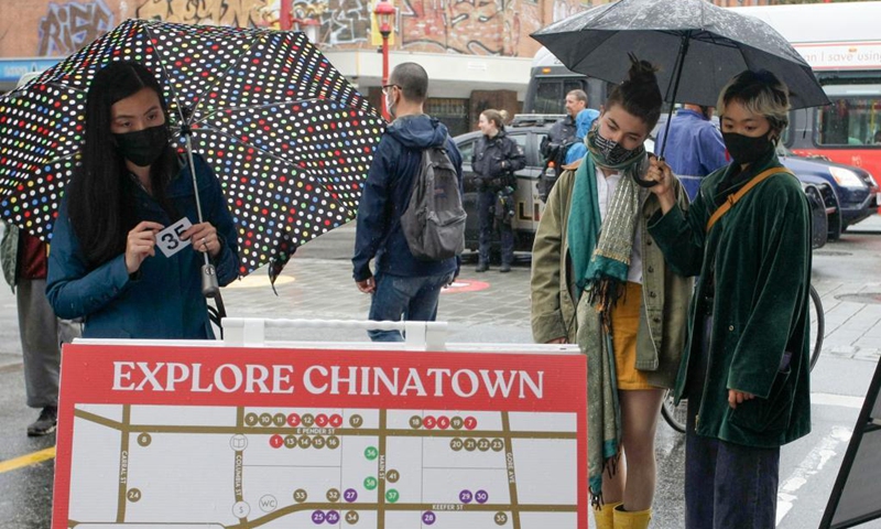 People look at the directory of the shops during the Light Up Chinatown event at Chinatown in Vancouver, British Columbia, Canada, Sept. 11, 2021. The two-day event hosted by Chinatown Business Improvement Association featuring live entertainment, food trucks, lights and decorations. The organizer wishes to bring back tourists and shoppers as the businesses are impacted by the COVID-19 pandemic and anti-Asian hate crimes over the past months.Photo: Xinhua