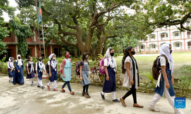 Students line up to enter classrooms at a school in Dhaka, Bangladesh, Sept. 14, 2021. Schools and colleges in Bangladesh reopened on Sunday after being closed for more than one and a half year as fresh COVID-19 cases have begun to fall. Photo:Xinhua