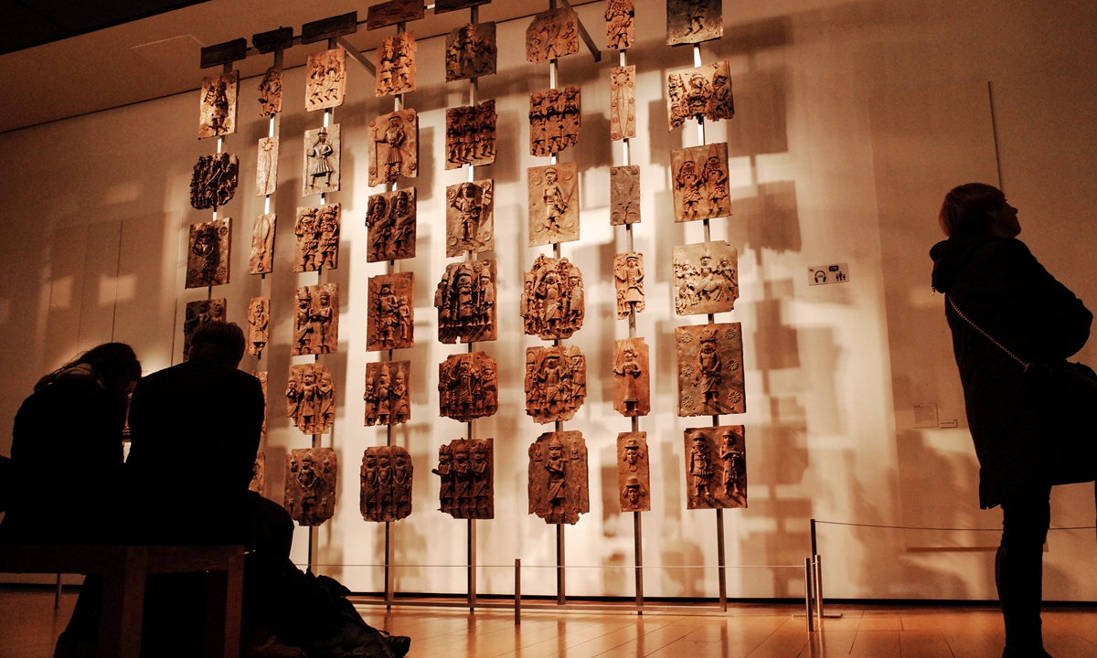 Visitors view the contentious Benin plaques exhibit (more commonly known as the Benin bronzes) in the British Museum in London, the UK, on February 13, 2020. Photo: AFP