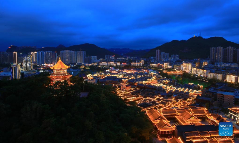 Photo taken on Aug. 10, 2021 shows the night view of Zhongnanmen Historical and Cultural Tourist Area in Tongren City, southwest China's Guizhou Province. (Photo by Peng Jun/Xinhua)