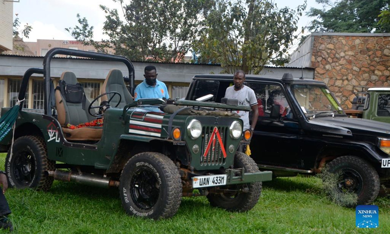 Visitors view a jeep at the Independence Day Vintage Car Show in Kampala, Uganda, Oct. 9, 2021. Over 70 cars on Saturday were displayed during the event.(Photo: Xinhua)