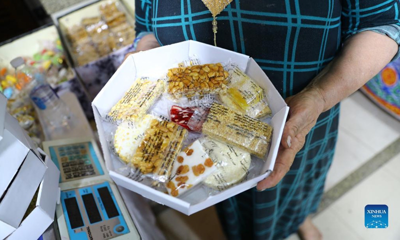 A vendor shows special candies and sweets for the Prophet Muhammad's birthday celebration at a store in Tanta City, Governorate of Gharbia, Egypt, on Oct. 11, 2021. The special candies and sweets have been a major feature of Egyptian celebrations on the birthday of the Prophet Muhammad, which falls on Oct. 19 this year. (Xinhua/Ahmed Gomaa)