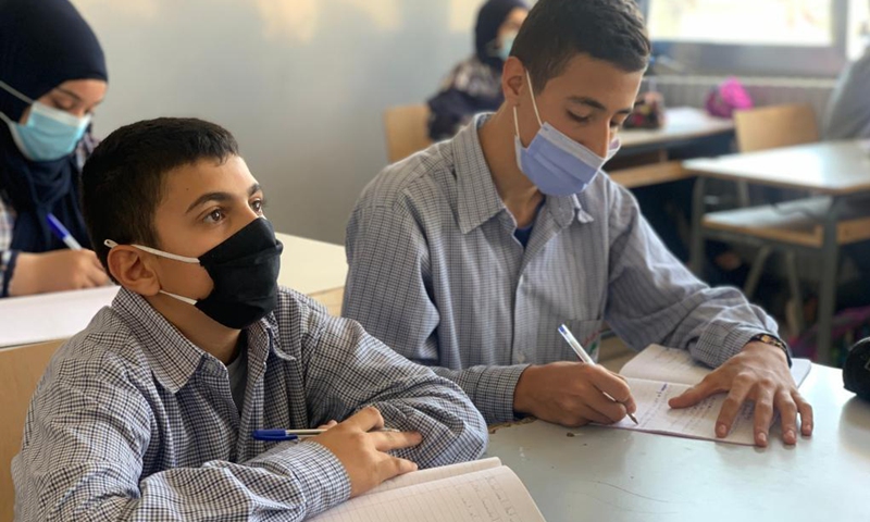 Students take their first class at a school in the city of Nabatiyeh, southern Lebanon, on Oct. 11, 2021. Lebanese students returned to their schools as the country's Ministry of Education had announced the reopening of public schools.(Photo: Xinhua)