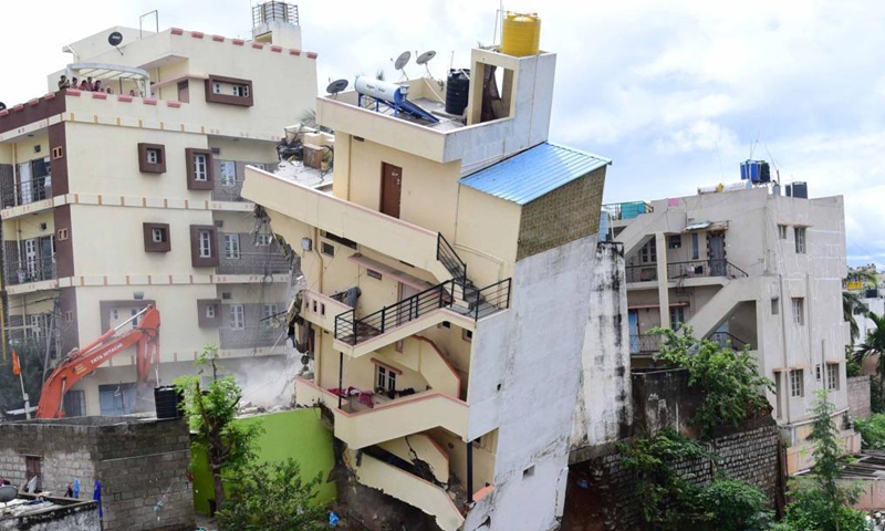 Photo taken on Oct. 13, 2021 shows the debris of a collapsed building in Bangalore, India. A residential building in Kamalanagar of Bangalore collapsed due to incessant rains. No casualties were reported. (Str/Xinhua)