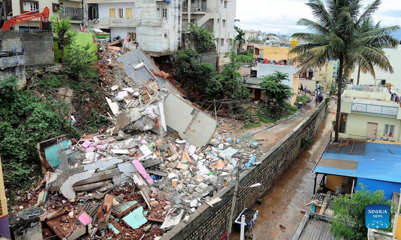 Photo taken on Oct. 13, 2021 shows the debris of a collapsed building in Bangalore, India. A residential building in Kamalanagar of Bangalore collapsed due to incessant rains. No casualties were reported. (Str/Xinhua)