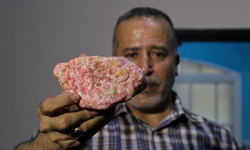 Palestinian Salah al-Kahlout, 53, displays a rare stone at his center in Jabalia refugee camp in northern Gaza Strip, on Oct. 13, 2021. Al-Kahlout has been collecting rare stones since 2000.Photo:Xinhua