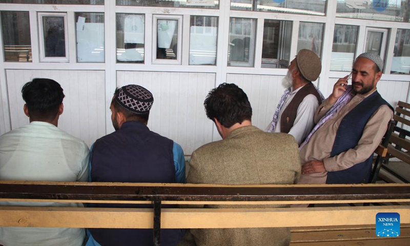 People wait to receive their electronic national identity cards (e-ID cards) in Kabul, capital of Afghanistan, Oct. 17, 2021. Authorities in Kabul have resumed the electronic national identity card issuance service, the local television channel Tolonews reported Sunday. The service was resumed Saturday after two months of a halt and in the first phase, 80,000 e-ID cards will be issued, the report said.(Photo:Xinhua)