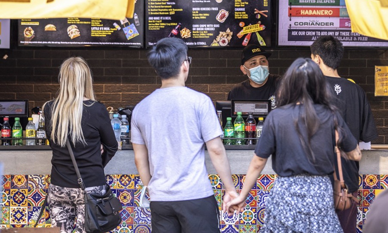 People order their food at an outdoor restaurant in Sydney, Australia, on Oct. 18, 2021.(Photo: Xinhua)