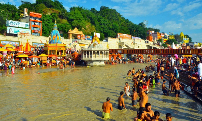 Hindu devotees take a holy dip in Ganges river on the occasion of Sharad and Laxmi purnima or full moon in the town of Haridwar, northern Indian state of Uttarakhand on Oct. 20, 2021.(Photo: Xinhua)