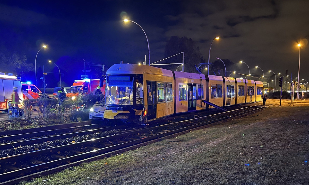 Rescue workers are on the scene after a tram crashed into a car in Berlin-Lichtenberg, Germany on Sunday. At least five people were injured in the collision. Photo: AFP