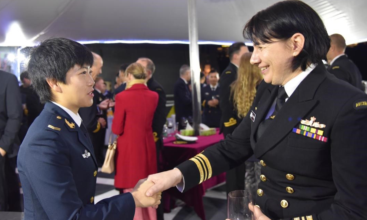 During the 25th Chinese naval escort taskforce visit to Australia, Song Xi salutes local female crew at a deck reception. Photo: Courtesy of Song Xi