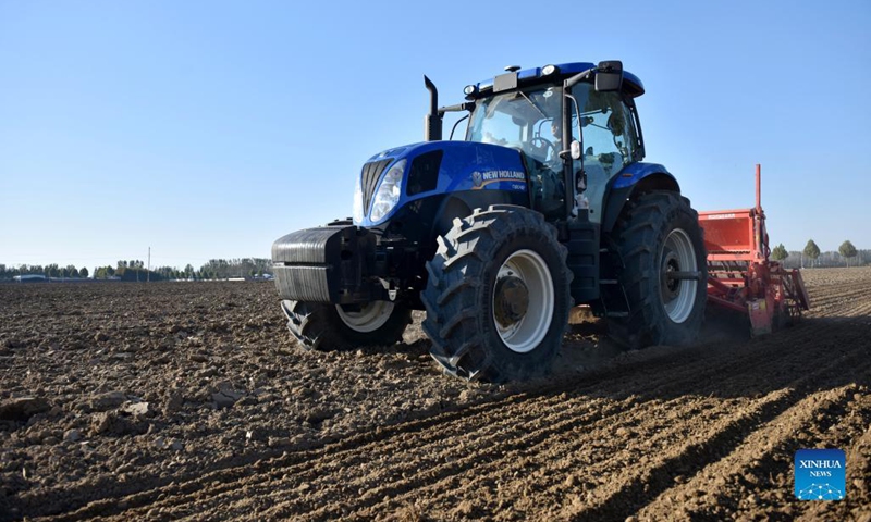 Agricultural machines sow seeds of winter wheat in Xingtai, N China ...