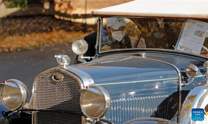 A visitor looks at a 1931 Ford Model A Roadster vintage car on display during an event organized by Retromobil Club Romania in Bucharest, capital of Romania, on Oct. 28, 2021.Photo:Xinhua