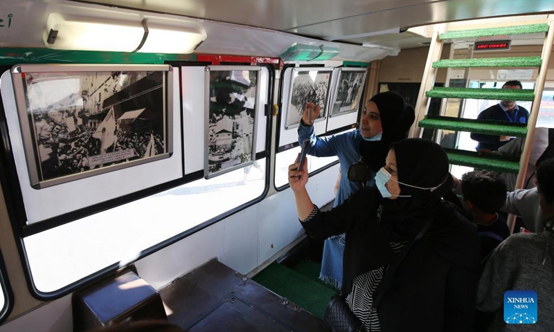 Algerian people visit a mobile museum converted by a bus in Algiers, Algeria, on Oct. 31, 2021.Photo:Xinhua