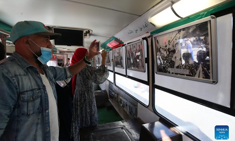 Algerian people visit a mobile museum converted by a bus in Algiers, Algeria, on Oct. 31, 2021.Photo:Xinhua