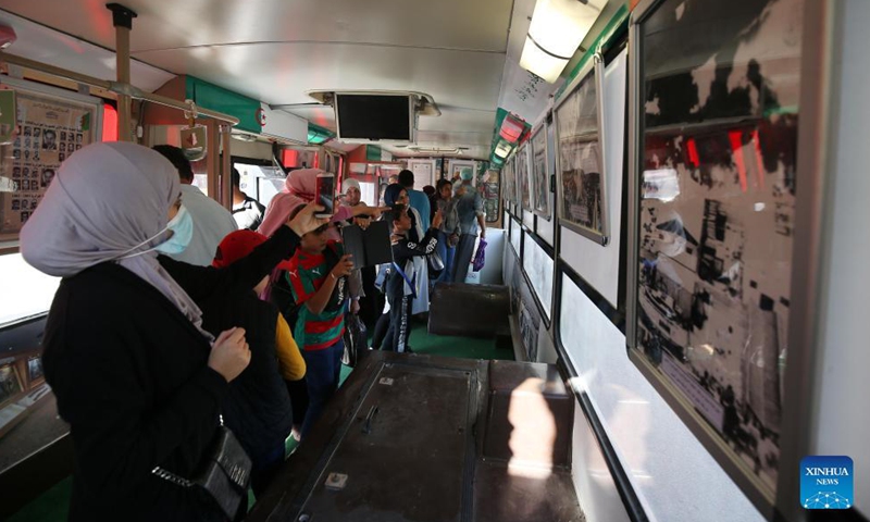 Algerian people visit a mobile museum converted by a bus in Algiers, Algeria, on Oct. 31, 2021.Photo:Xinhua