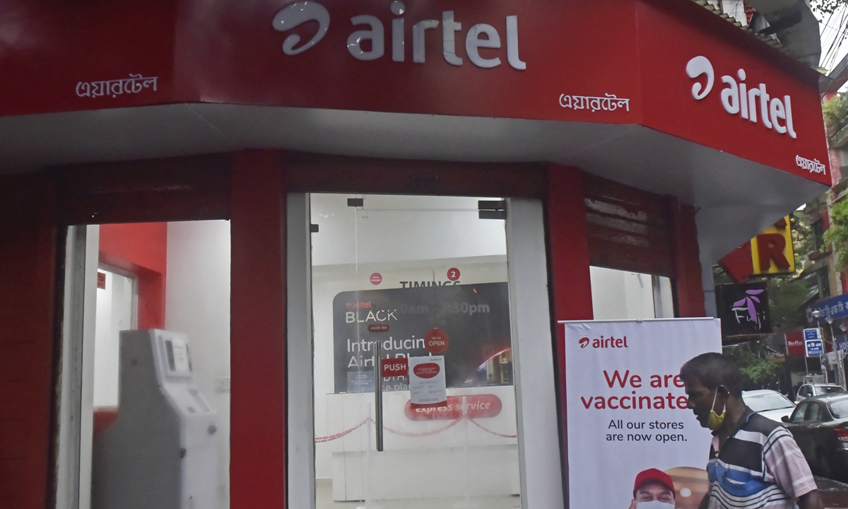 A man walks past an Airtel store in Kolkata, India,on July 28, 2021. Photo: AFP