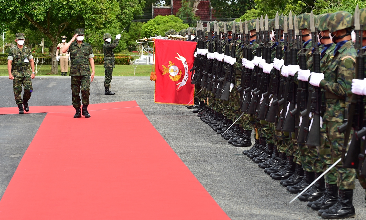 Royal Thai Navy chief Admiral Somprasong Nilsamai (second left) inspects Royal Thai Marines during his visit to Chulabhorn Camp in Thailand's southern province of Narathiwat on Sunday. Photo: AFP