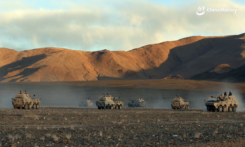 Armored vehicles attached to a division under the PLA Xinjiang Military Command advance to engage mock enemy positions during a live-fire test in late October, 2021. The training exercise was conducted on the Karakoram Plateau at about 4,500 meters above sea level, with an annual average temperature below -10°C. (eng.chinamil.com.cn/Photo by/ Liu Yong, Li Kang, Zhang Li, Shuai Lijian and Yan Shiqiang)