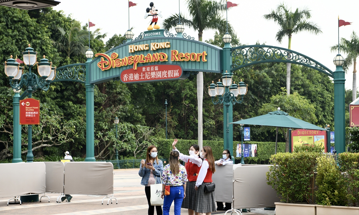 Visitors and workers are seen at the Disneyland Park in Hong Kong. The park suspended operations for one day on November 17, 2021, after the visit of a confirmed COVID-19 guest. Photo: cnsphoto