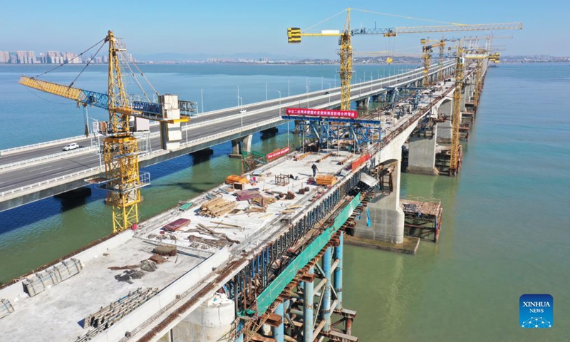 Aerial photo taken on Nov. 30, 2021 shows a view of Quanzhou Bay cross-sea bridge of the Fuzhou-Xiamen high-speed railway in southeast China's Fujian Province. (Xinhua/Lin Shanchuan)