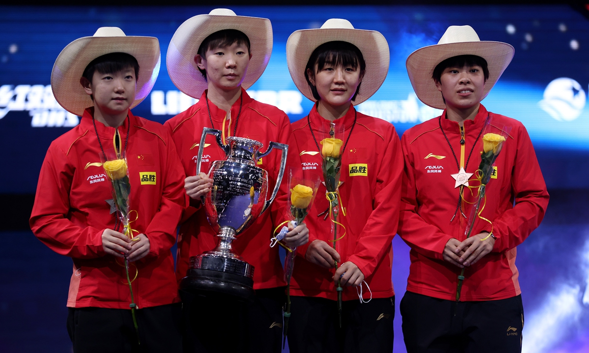 Women's singles gold medalist Wang Manyu (second from left), silver medalist Sun Yingsha (left), and bronze medalists Chen Meng (second from right) and Wang Yidi pose on the podium at the 2021 World Table Tennis Championships on November 29, 2021 in Houston, Texas.  Photo: VCG