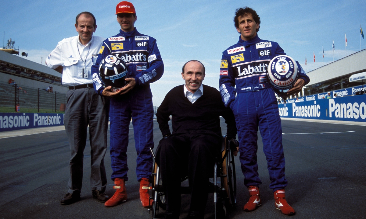 Frank Williams (in wheelchair) takes a photo during the Grand Prix of South Africa on March 14, 1993 in Midrand, South Africa. Photo: VCG