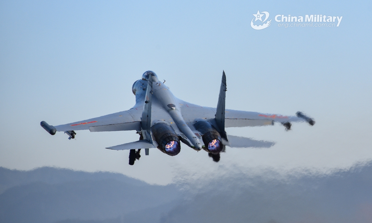 A fighter jet attached to an aviation brigade of the air force under the PLA Eastern Theater Command takes off during a round-the-clock flight training exercise on November 26, 2021. Photo:China Military