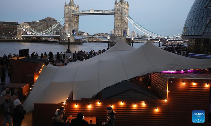 People visit 2021 Christmas By The River in London, Britain, Dec. 4, 2021.Photo:Xinhua