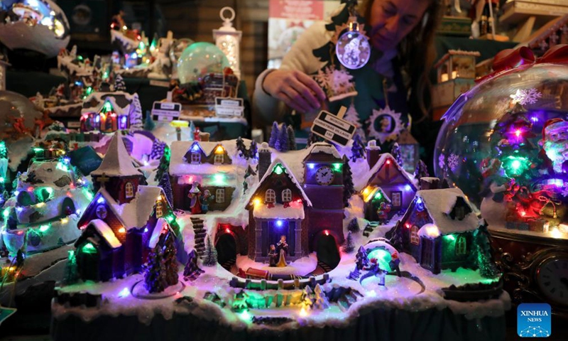 Christmas artworks are seen on a booth at 2021 Christmas By The River in London, Britain, Dec. 4, 2021.Photo:Xinhua