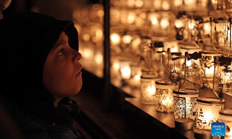 Christmas lights are seen on a booth at 2021 Christmas By The River in London, Britain, Dec. 4, 2021.Photo:Xinhua