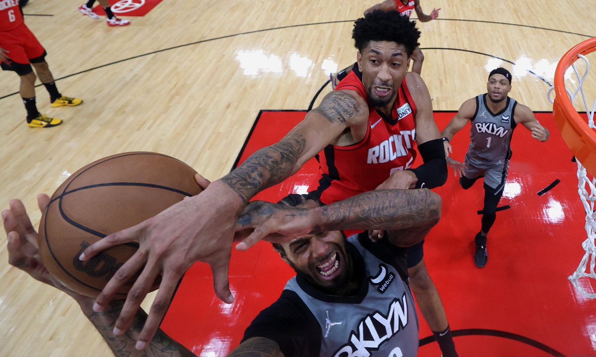 Christian Wood of the Houston Rockets blocks a shot attempt from James Johnson of the Brooklyn Nets on December 8, 2021 in Houston, Texas. Photo: VCG